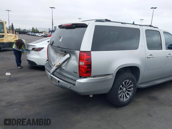 2010 Chevrolet Suburban LT with VIN 1GNUCJE03AR238548, listed as a IAAI auction lot 42104596 with 153,959 mi miles and . Bid and sale history available at DreamBid. Image 4.