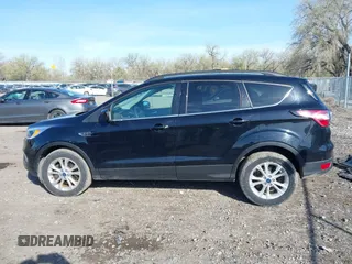 2018 Ford Escape SE z VIN 1FMCU9GD5JUB15259, wystawiony jako IAAI lot #42182040 z przebiegiem 122 194 mil mil oraz . Historia ofert i sprzedaży dostępna na DreamBid. Obrazek 15.