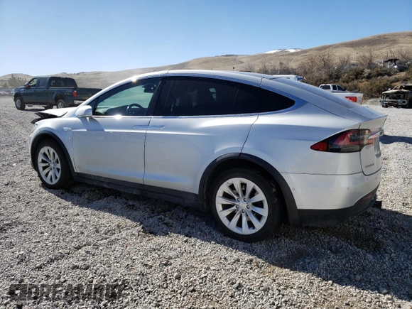2016 Tesla Model X 70D with VIN 5YJXCAE29GF004033, listed as a Copart auction lot 49673975 with 220,259 mi miles and Salvage Title. Bid and sale history available at DreamBid. Image 2.