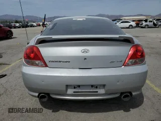 2006 Hyundai Tiburon GT z VIN KMHHN65F06U203701, wystawiony jako Copart lot #52374135 z przebiegiem 90 796 mil mil oraz Szkody całkowita. Historia ofert i sprzedaży dostępna na DreamBid. Obrazek 6.