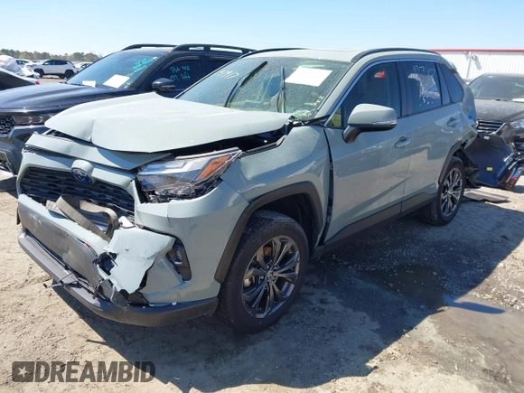 2023 Toyota RAV4 Hybrid XLE Premium z VIN JTMB6RFV8PD116502, wystawiony jako IAAI lot #41888174 z przebiegiem 19 253 mil mil oraz . Historia ofert i sprzedaży dostępna na DreamBid. Obrazek 17.