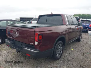 2020 Honda Ridgeline RTL-E with VIN 5FPYK3F7XLB012298, listed as a IAAI auction lot 42230880 with 48,252 mi miles and . Bid and sale history available at DreamBid. Image 4.
