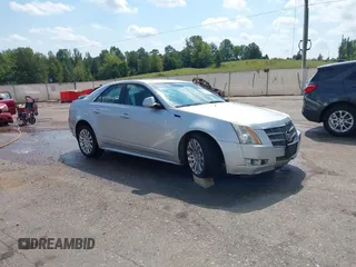 2011 Cadillac CTS Performance with VIN 1G6DM5ED2B0110231, listed as a IAAI auction lot 40410328 with 131,005 mi miles and . Bid and sale history available at DreamBid. Image 1.