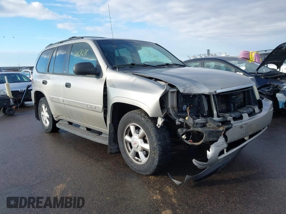 2003 GMC Envoy SLT with VIN 1GKDT13S532308502, listed as a IAAI auction lot 41676188 with 218,626 mi miles. Bid and sale history available at carsss.com. Image 6.