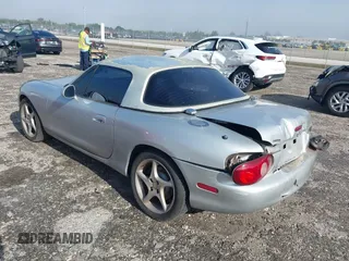 2003 Mazda MX-5 Miata Cloth with VIN JM1NB353730311899, listed as a IAAI auction lot 41929811 with 99,589 mi miles and . Bid and sale history available at DreamBid. Image 3.