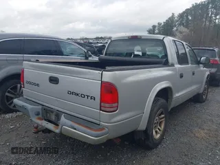 2003 Dodge Dakota z VIN 1D7HL38Z83S184469, wystawiony jako IAAI lot #41714931 z przebiegiem 194 373 mil mil oraz . Historia ofert i sprzedaży dostępna na DreamBid. Obrazek 4.
