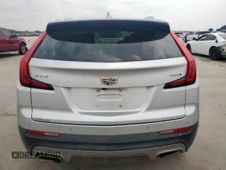 2021 Cadillac XT4 FWD Premium Luxury z VIN 1GYFZCR42MF004233, wystawiony jako Copart lot #57229385 z przebiegiem 98 387 mil mil oraz Szkody całkowita. Historia ofert i sprzedaży dostępna na DreamBid. Obrazek 6.