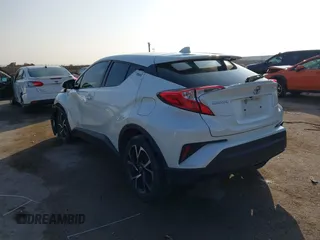 2021 Toyota C-HR LE with VIN JTNKHMBXXM1099019, listed as a IAAI auction lot 41525170 with 63,519 mi miles. Bid and sale history available at carsss.com. Image 3.