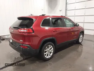 2015 Jeep Cherokee Latitude with VIN 1C4PJLCB6FW616477, listed as a IAAI auction lot 41812431 with 131,234 mi miles. Bid and sale history available at carsss.com. Image 4.
