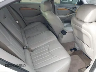 2002 Jaguar S-Type with VIN SAJDA01P12GM35163, listed as a IAAI auction lot 41097415 with 114,017 mi miles and . Bid and sale history available at DreamBid. Image 8.