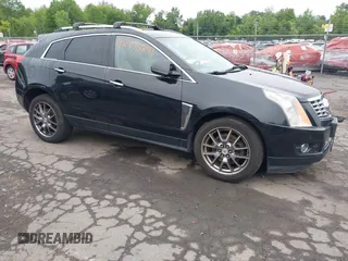 2013 Cadillac SRX Performance Collection z VIN 3GYFNHE39DS642111, wystawiony jako IAAI lot #42470291 z przebiegiem 176 239 mil mil oraz . Historia ofert i sprzedaży dostępna na DreamBid. Obrazek 13.