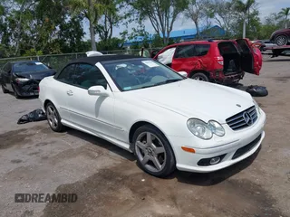 2005 Mercedes-Benz CLK 5.0L with VIN WDBTK75J55F123328, listed as a IAAI auction lot 42082590 with 58,969 mi miles. Bid and sale history available at carsss.com. Image 1.