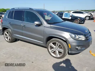 2014 Volkswagen Tiguan SEL z VIN WVGAV3AX6EW030705, wystawiony jako Copart lot #52156805 z przebiegiem 142 377 mil mil oraz Szkoda całkowita • Salvage title. Historia ofert i sprzedaży dostępna na DreamBid. Obrazek 4.