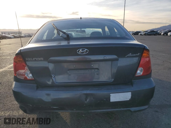 2005 Hyundai Accent GLS with VIN KMHCG35C65U359247, listed as a Copart auction lot 79305324 with 120,985 mi miles and Salvage Title. Bid and sale history available at carsss.com. Image 6.