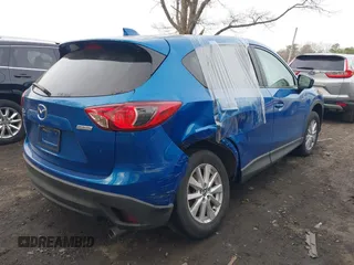 2013 Mazda CX-5 Touring with VIN JM3KE4CE0D0160711, listed as a IAAI auction lot 41843658 with 65,391 mi miles. Bid and sale history available at carsss.com. Image 4.