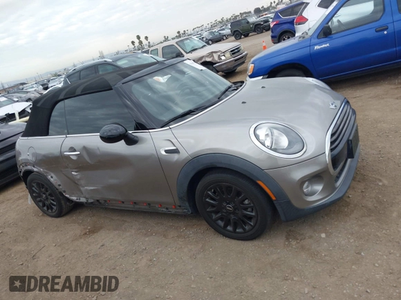 2016 MINI Convertible z VIN WMWWG5C51G3A81075, wystawiony jako IAAI lot #41681717 z przebiegiem 54 956 mil mil oraz . Historia ofert i sprzedaży dostępna na DreamBid. Obrazek 13.