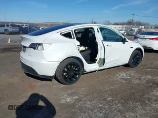 2022 Tesla Model Y Long Range with VIN 7SAYGAEE3NF337220, listed as a IAAI auction lot 41703912 with 46,319 mi miles and . Bid and sale history available at carsss.com. Image 4.