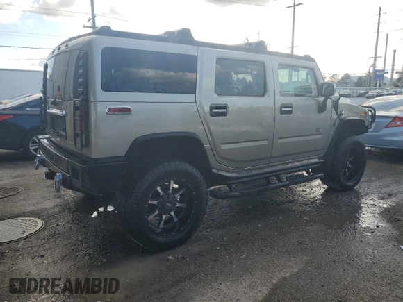 2003 Hummer H2 with VIN 5GRGN23U13H147071, listed as a Copart auction lot 82255674 with 272,215 mi miles and Salvage Title. Bid and sale history available at carsss.com. Image 3.