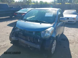 2012 Scion iQ with VIN JTNJJXB05CJ021301, listed as a IAAI auction lot 42323450 with 97,185 mi miles and . Bid and sale history available at DreamBid. Image 2.