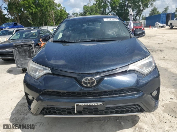2018 Toyota RAV4 SE with VIN JTMJFREVXJD256779, listed as a Copart auction lot 52521195 with 100,453 mi miles and Salvage Title. Bid and sale history available at carsss.com. Image 5.