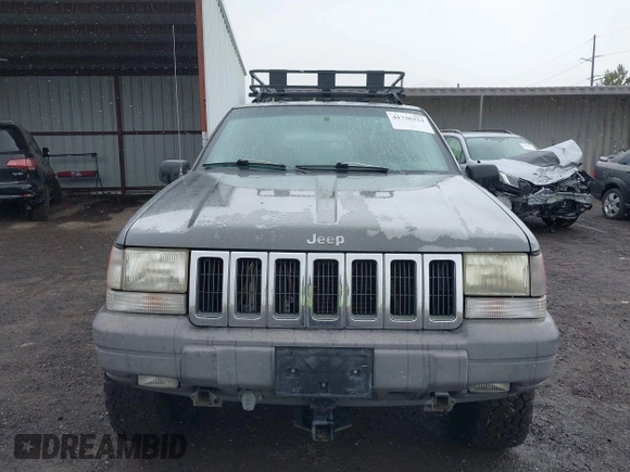 1997 Jeep Grand Cherokee Laredo with VIN 1J4GZ58Y8VC624804, listed as a IAAI auction lot 41736324 with 165,851 mi miles. Bid and sale history available at carsss.com. Image 6.
