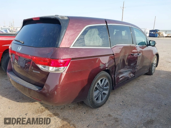 2015 Honda Odyssey Touring Elite with VIN 5FNRL5H98FB111226, listed as a IAAI auction lot 42136888 with 60,266 mi miles and . Bid and sale history available at DreamBid. Image 4.