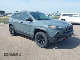 2015 Jeep Cherokee Trailhawk with VIN 1C4PJMBS7FW569497, listed as a IAAI auction lot 42744459 with 177,265 mi miles and . Bid and sale history available at DreamBid. Image 1.