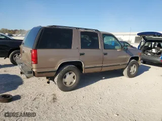 1996 Chevrolet Tahoe with VIN 1GNEK13R1TJ385350, listed as a Copart auction lot 77593884 with 169,178 mi miles and Salvage Title. Bid and sale history available at carsss.com. Image 3.