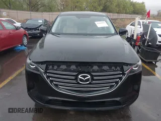 2016 Mazda CX-9 Touring with VIN JM3TCBCY5G0101490, listed as a IAAI auction lot 42062846 with 85,352 mi miles and . Bid and sale history available at DreamBid. Image 12.