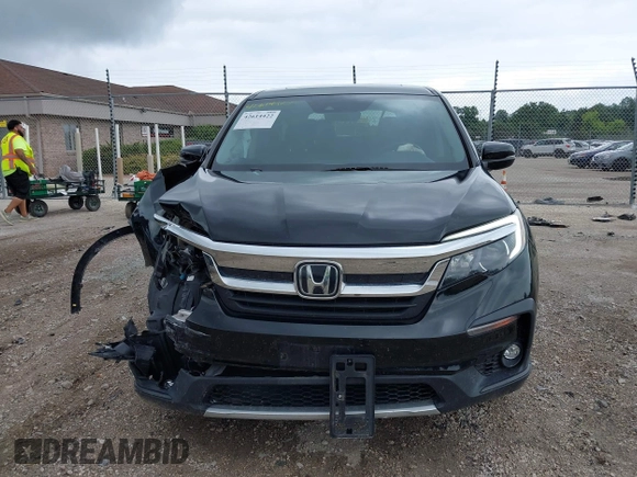 2020 Honda Pilot EX-L with VIN 5FNYF6H57LB059332, listed as a IAAI auction lot 42614422 with 110,279 mi miles and . Bid and sale history available at DreamBid. Image 12.