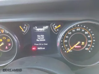 2018 Jeep Wrangler Unlimited Sport S with VIN 1C4HJXDG1JW183052, listed as a IAAI auction lot 41372557 with 56,076 mi miles. Bid and sale history available at carsss.com. Image 7.