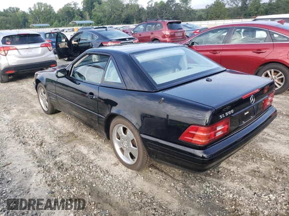 2000 Mercedes-Benz SL-Class with VIN WDBFA68F0YF190618, listed as a Copart auction lot 64791414 with 24,489 mi miles and Salvage Title. Bid and sale history available at carsss.com. Image 2.