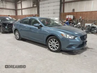 2014 Mazda 6 i Sport with VIN JM1GJ1U61E1148983, listed as a IAAI auction lot 41977553 with 100,668 mi miles. Bid and sale history available at carsss.com. Image 1.