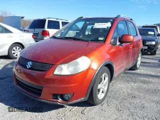 2009 Suzuki SX4 Touring AWD with VIN JS2YB417595100925, listed as a IAAI auction lot 41693882 with 76,972 mi miles and . Bid and sale history available at DreamBid. Image 6.