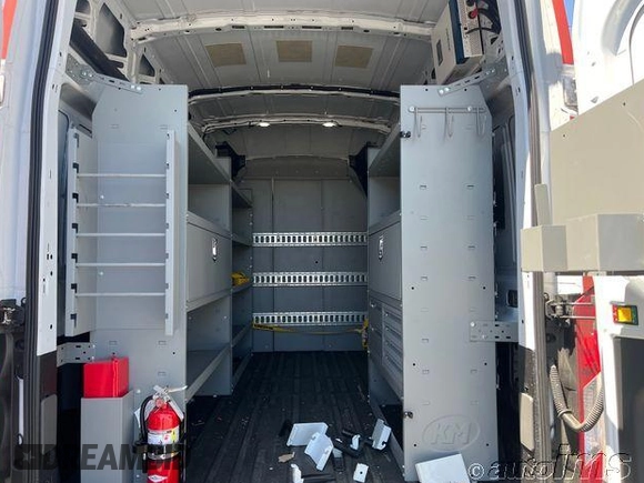 2023 Ford Transit Cargo z VIN 1FTBR1X80PKC02609, wystawiony jako IAAI lot #42845487 z przebiegiem 6 879 mil mil oraz . Historia ofert i sprzedaży dostępna na DreamBid. Obrazek 1.