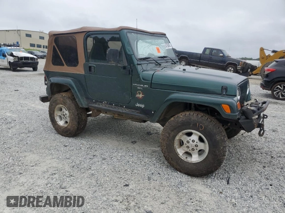 1999 Jeep Wrangler Sahara with VIN 1J4FY49S0XP489462, listed as a Copart auction lot 54750405 with 134,134 mi miles and Non repairable. Bid and sale history available at DreamBid. Image 4.