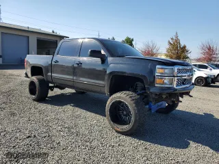 2015 Chevrolet Silverado 1500 LT with VIN 3GCUKREC3FG356823, listed as a Copart auction lot 73223684 with 148,139 mi miles and Salvage Title. Bid and sale history available at carsss.com. Image 4.
