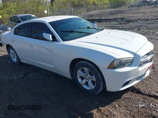 2014 Dodge Charger SXT with VIN 2C3CDXHG0EH328912, listed as a IAAI auction lot 42007391 with 206,868 mi miles. Bid and sale history available at carsss.com. Image 1.
