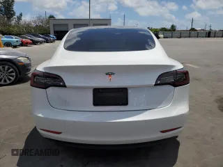 2021 Tesla Model 3 Standard Range Plus with VIN 5YJ3E1EA2MF985463, listed as a Copart auction lot 53311455 with 23,176 mi miles and Clean Title. Bid and sale history available at DreamBid. Image 6.