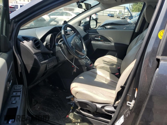 2012 Mazda 5 Grand Touring with VIN JM1CW2DLXC0121134, listed as a Copart auction lot 56539825 with 130,962 mi miles and Salvage title. Bid and sale history available at DreamBid. Image 7.