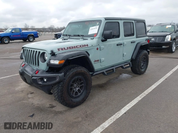 2023 Jeep Wrangler Rubicon with VIN 1C4JJXFG7PW654564, listed as a IAAI auction lot 41833534 with 22,277 mi miles and . Bid and sale history available at DreamBid. Image 2.