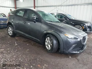 2016 Mazda CX-3 Sport with VIN JM1DKFB70G0130573, listed as a IAAI auction lot 41393339 with 98,669 mi miles. Bid and sale history available at carsss.com. Image 1.
