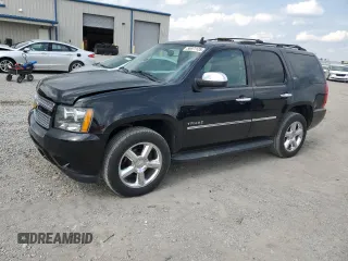 2014 Chevrolet Tahoe LTZ with VIN 1GNSKCE0XER228028, listed as a Copart auction lot 56971135 with 155,285 mi miles and Salvage title. Bid and sale history available at DreamBid. Image 1.