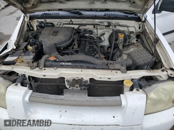 2001 Nissan Frontier XE with VIN 1N6DD26S91C398560, listed as a Copart auction lot 87893925 with 184,831 mi miles and Salvage title. Bid and sale history available at DreamBid. Image 12.