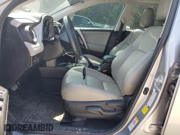 2018 Toyota RAV4 XLE with VIN 2T3WFREVXJW427748, listed as a Copart auction lot 61833055 with 104,057 mi miles and Salvage title. Bid and sale history available at DreamBid. Image 7.