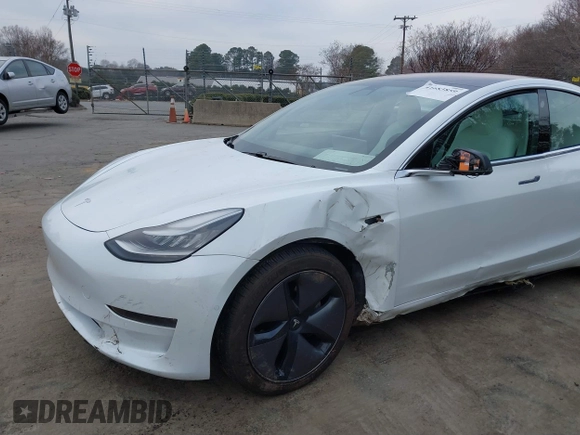 2018 Tesla Model 3 Long Range Battery with VIN 5YJ3E1EB4JF086012, listed as a IAAI auction lot 41683859 with 52,059 mi miles and . Bid and sale history available at DreamBid. Image 6.
