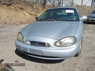 1999 Mercury Sable LS z VIN 1MEFM53S7XA622932, wystawiony jako IAAI lot #41708531 z przebiegiem 155 702 mil mil oraz . Historia ofert i sprzedaży dostępna na DreamBid. Obrazek 15.