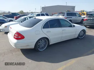 2003 Mercedes-Benz E-Class 3.2L with VIN WDBUF65J63A233107, listed as a IAAI auction lot 42004763 with 151,327 mi miles. Bid and sale history available at carsss.com. Image 4.