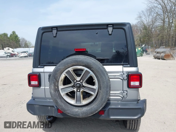 2018 Jeep Wrangler Unlimited Sahara with VIN 1C4HJXEG4JW141540, listed as a IAAI auction lot 42148402 with 43,909 mi miles and . Bid and sale history available at DreamBid. Image 16.