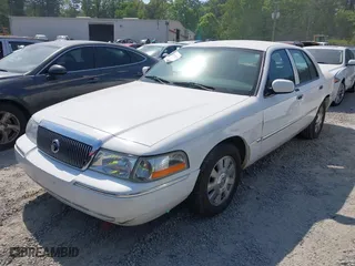 2003 Mercury Grand Marquis LS Premium with VIN 2MEFM75W33X669341, listed as a IAAI auction lot 42063018 with 124,047 mi miles. Bid and sale history available at carsss.com. Image 2.